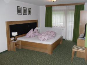 Postel nebo postele na pokoji v ubytování Jenneweinhof