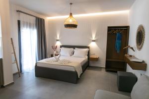 a bedroom with a bed in a room at Gaia Apartment II in Parga