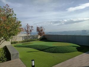 a yard with a golf course in the grass at Homesbyfs Youth City KLIA in Nilai