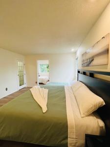 a bedroom with a large bed in a room at Beautiful home with one acre land for leisure time in Vancouver Island in Nanaimo