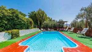 a swimming pool in the backyard of a house at Molino Los Justos - Casa Vieja- Algarinejo by Ruralidays in Algarinejo
