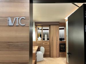 a lobby with a vtec sign on the wall at Alevic Hotel Sirmione in Sirmione