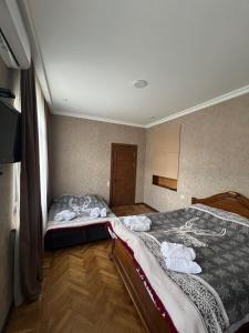 Voodi või voodid majutusasutuse Shota's Guest House toas