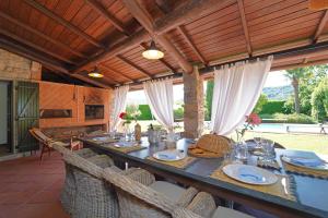 a dining room with a long table with chairs at Villa Lavanda 10 Pax By VILLASRETREATS in Beverino