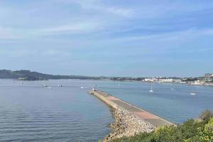 a large body of water with boats in it at Central City Centre 3 bedroom home Private Parking in Plymouth