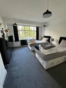 Ένα ή περισσότερα κρεβάτια σε δωμάτιο στο Central City Centre 3 bedroom home Private Parking