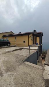 a building with a car parked in a parking lot at Apartments New Charming in Senj