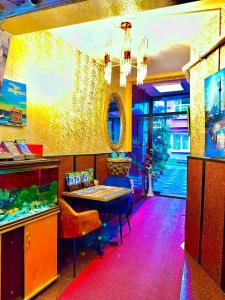 a dining room with a table and a fish tank at Sultanahmet life suites apartment in Istanbul