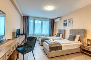 TV a/nebo společenská místnost v ubytování VALEMO Apart House