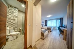 Koupelna v ubytování VALEMO Apart House + 50 fotografií