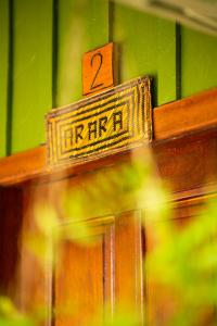 a wooden sign on top of a wooden table at Manati Lodge in Manacapuru