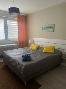 Posteľ alebo postele v izbe v ubytovaní Apartament Ukiel Bałtycka