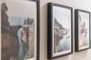 three framed photographs hanging on a wall at Stunning 2-Bed Apartment Fully Equipped - Clapham Junction - Battersea - 5 Minutes Train Station in London