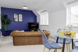 a living room with a couch and a table at K Suites - Shetland Court in Bridgwater