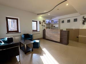 a living room with a couch and a table at Saryan Hotel Yerevan in Yerevan