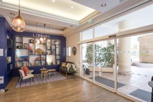 a living room with a large glass door at Frontière Monaco - Hypercentre - BX in Beausoleil +18 photos