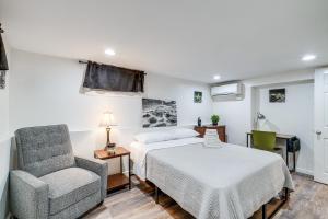 a bedroom with a bed and a chair at Updated Arlington Townhome about 5 Mi to National Mall in Arlington