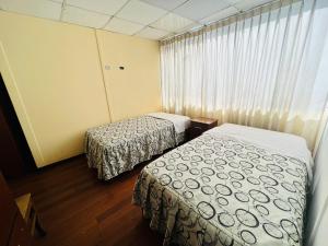 Een bed of bedden in een kamer bij OROSHEAM