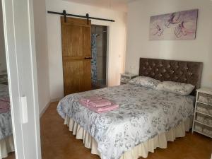 Postel nebo postele na pokoji v ubytování ROMANTICO