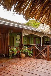 a porch of a building with a wooden deck at Manati Lodge in Manacapuru