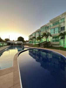 Πισίνα στο ή κοντά στο Apartamento no Condomínio Mar & Sol