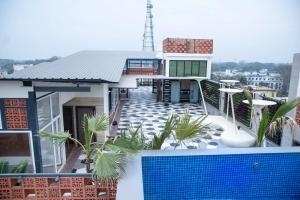 a house with a swimming pool on the roof at HOTEL LAKE VIEW in Baharampur