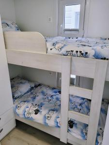 two bunk beds in a room with a mirror at MIRAMARE Romantic Experience with privat Jacuzzi - floating house in Portorož +45 photos