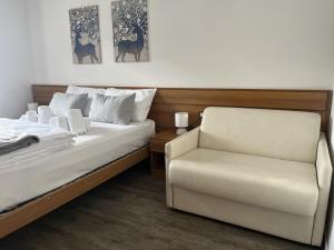 Giường trong phòng chung tại Hotel Lido
