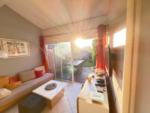 En eller flere senge i et værelse på Appartement T2 Duplex