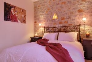 Postel nebo postele na pokoji v ubytování Byzantinon Hotel