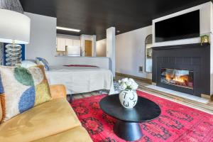 a living room with a couch and a fireplace at Quest Travels in Seattle