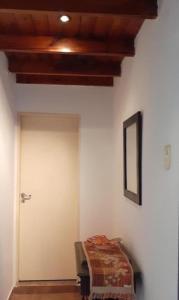 a room with a white wall with a door at Aero (a 8 cuadras del Colegio Militar de la Nación) in El Palomar