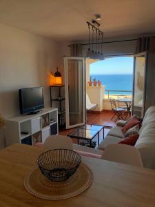 a living room with a view of the ocean at Apartamento de Carboneras - Terrazas y Vistas in Carboneras