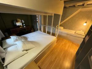 Letto o letti in una camera di La Maison du bonheur - Gîte RULINA - Corancy