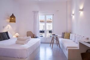 A bed or beds in a room at NESEA Boutique Apartments
