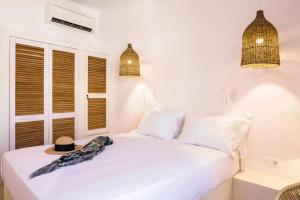 A bed or beds in a room at NESEA Boutique Apartments