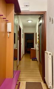 a corridor of an office building with a hallway at Alessandra in Fusine in Valromana
