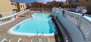 a swimming pool on the balcony of a building at PARAISO DE LUX in Costa de Antigua