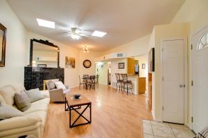 a living room with a couch and a table at Comfy Albuquerque Townhome Less Than 6 Mi to Downtown in Albuquerque