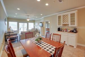 a kitchen and living room with a table and chairs at Hot Springs Condo on Lake Hamilton with Pool Access in Hot Springs