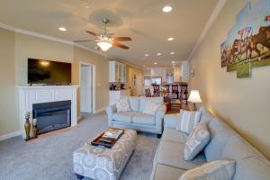 a living room with two couches and a fireplace at Hot Springs Condo on Lake Hamilton with Pool Access in Hot Springs