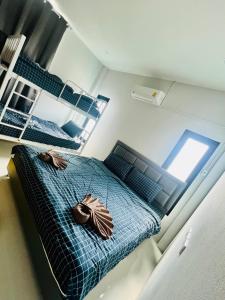 Ένα ή περισσότερα κρεβάτια σε δωμάτιο στο Kazokupoolvilla