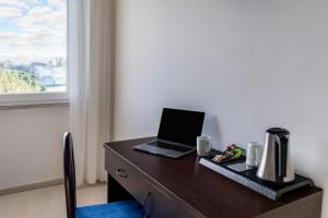 TV a/nebo společenská místnost v ubytování Hotel Sorriso