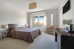 Postel nebo postele na pokoji v ubytování Hotel Sorriso
