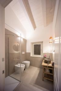 a bathroom with a toilet and a sink at Lombardi Rita - Colle S. Martino in Assisi