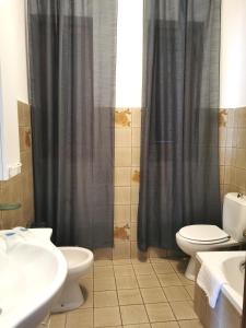 a bathroom with a shower and a toilet and a sink at Affittacamere La Palafitta in Portovenere