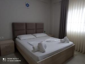 Postel nebo postele na pokoji v ubytování Vila Alia