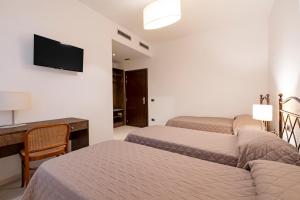 Postel nebo postele na pokoji v ubytování Hotel Sorriso