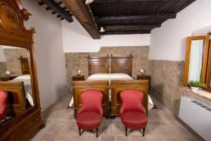 Postel nebo postele na pokoji v ubytování La Rocca - Palazzo Pallotti