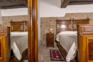 Postel nebo postele na pokoji v ubytování La Rocca - Palazzo Pallotti